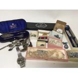 A collection of vintage silver and other costume jewellery, cased silver plated cutlery, a gents