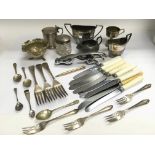 A small collection of metalware including a silver