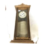 An oak wall clock Vienna type with visible pendulum - NO RESERVE