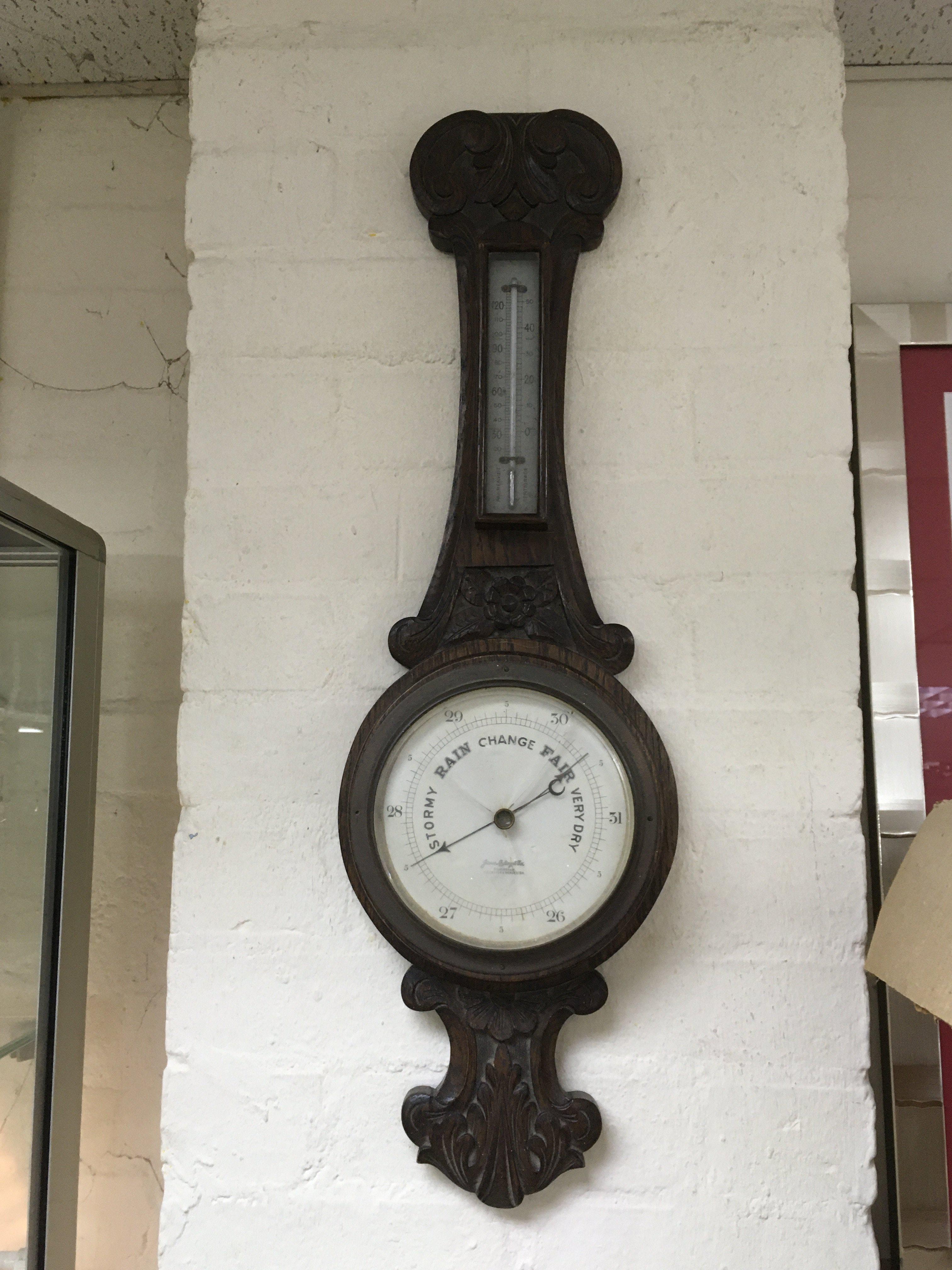 An oak cased wall barometer. NO RESERVE.