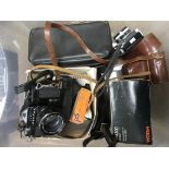 A collection of cameras, lenses and photographic e