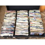 An extensive collection of 7 inch singles. This lot is sold in a DJ travel case and two additional
