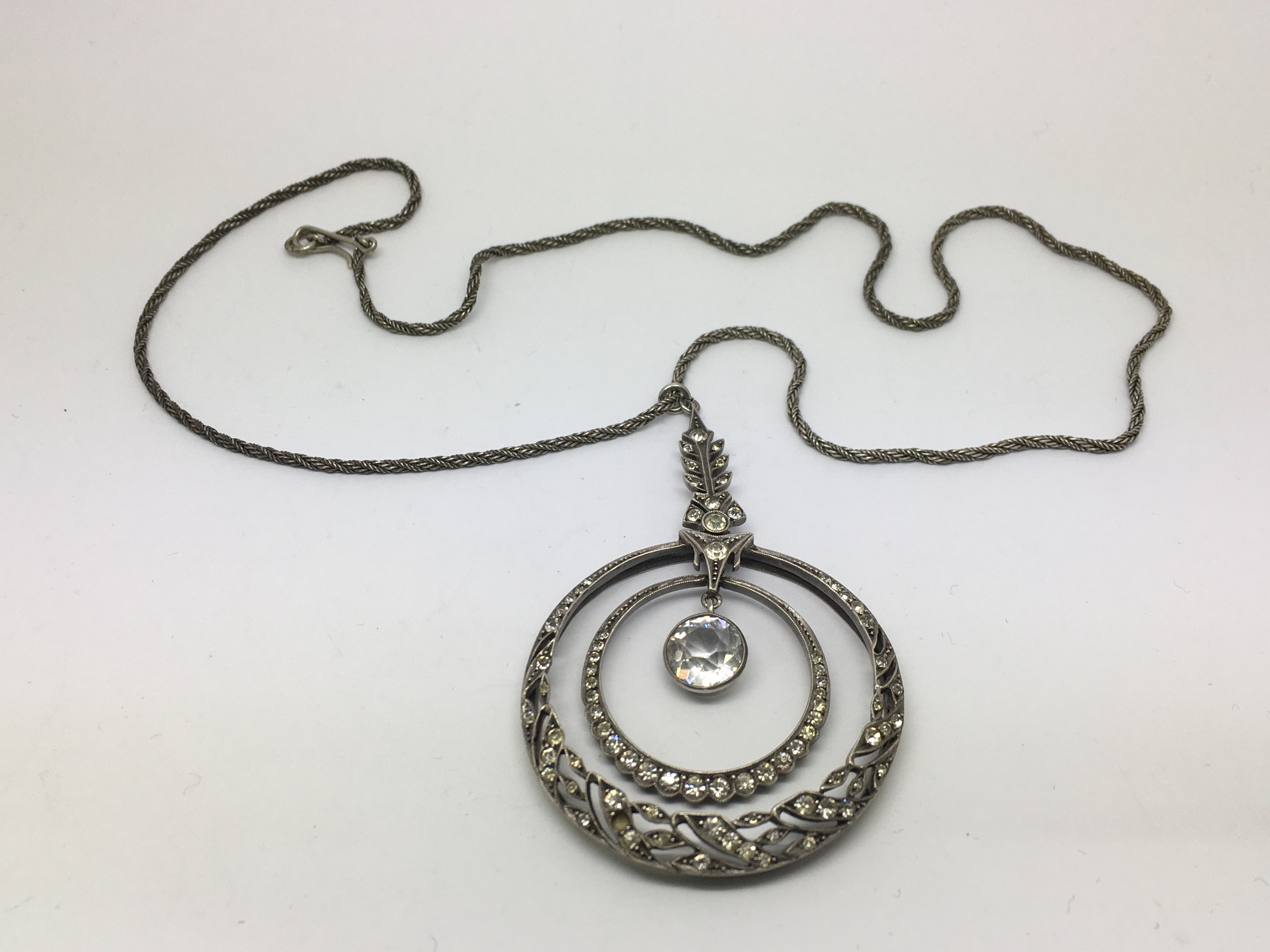 A sterling silver pendant on chain.