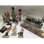 A collection of military figures including ceramic