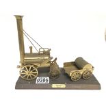 A brass model of Stephensons Rocket.