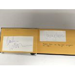 An autograph booklet with various signatures including Ian Botham, Gary Lineker, Dave Prowse, Des