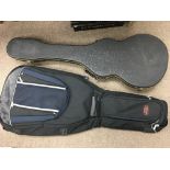 Four guitar cases comprising a hard shell carry ca