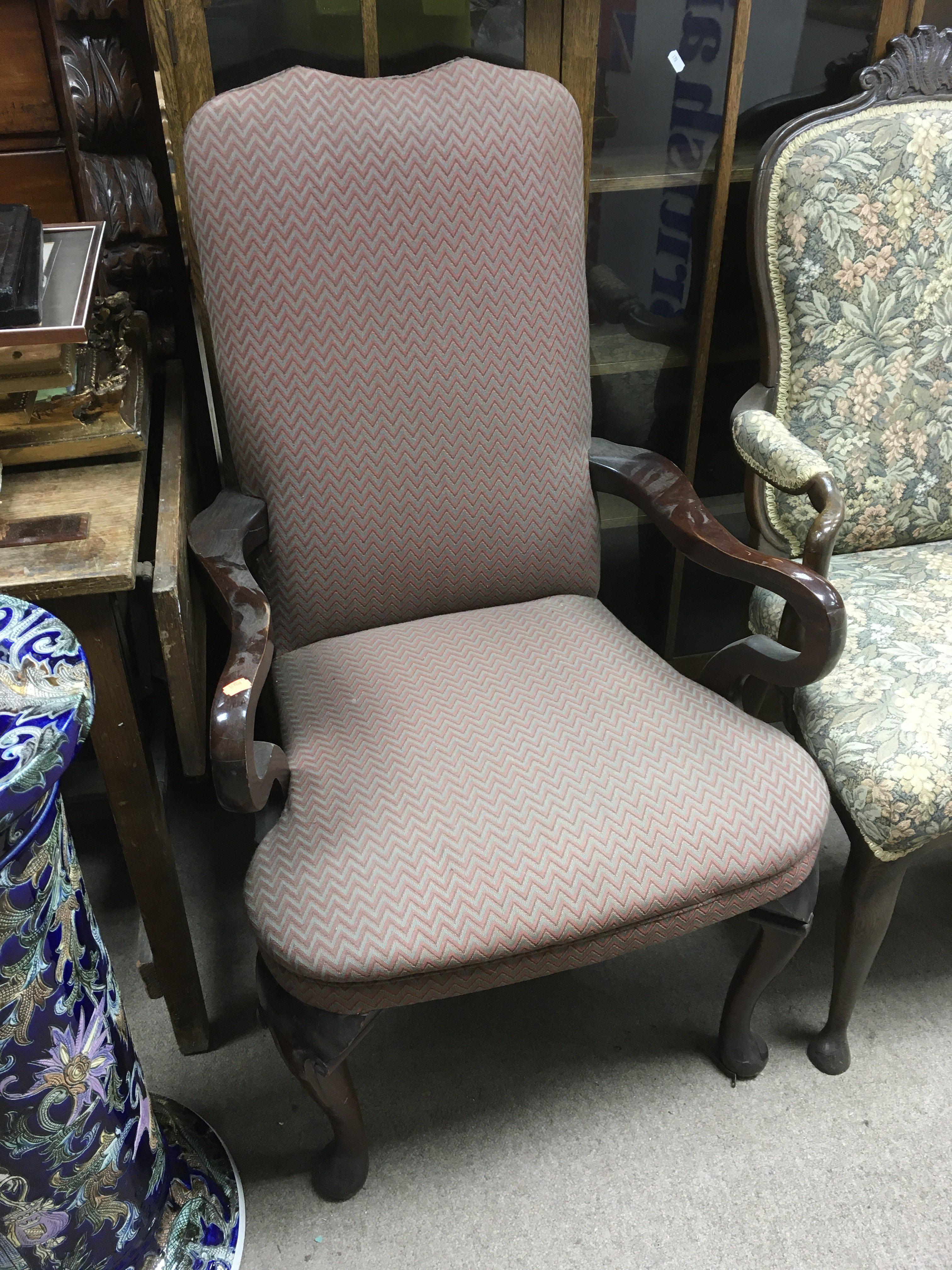 A mahogany framed chair with chevron pattern uphol