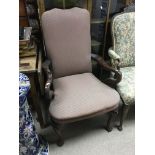 A mahogany framed chair with chevron pattern uphol