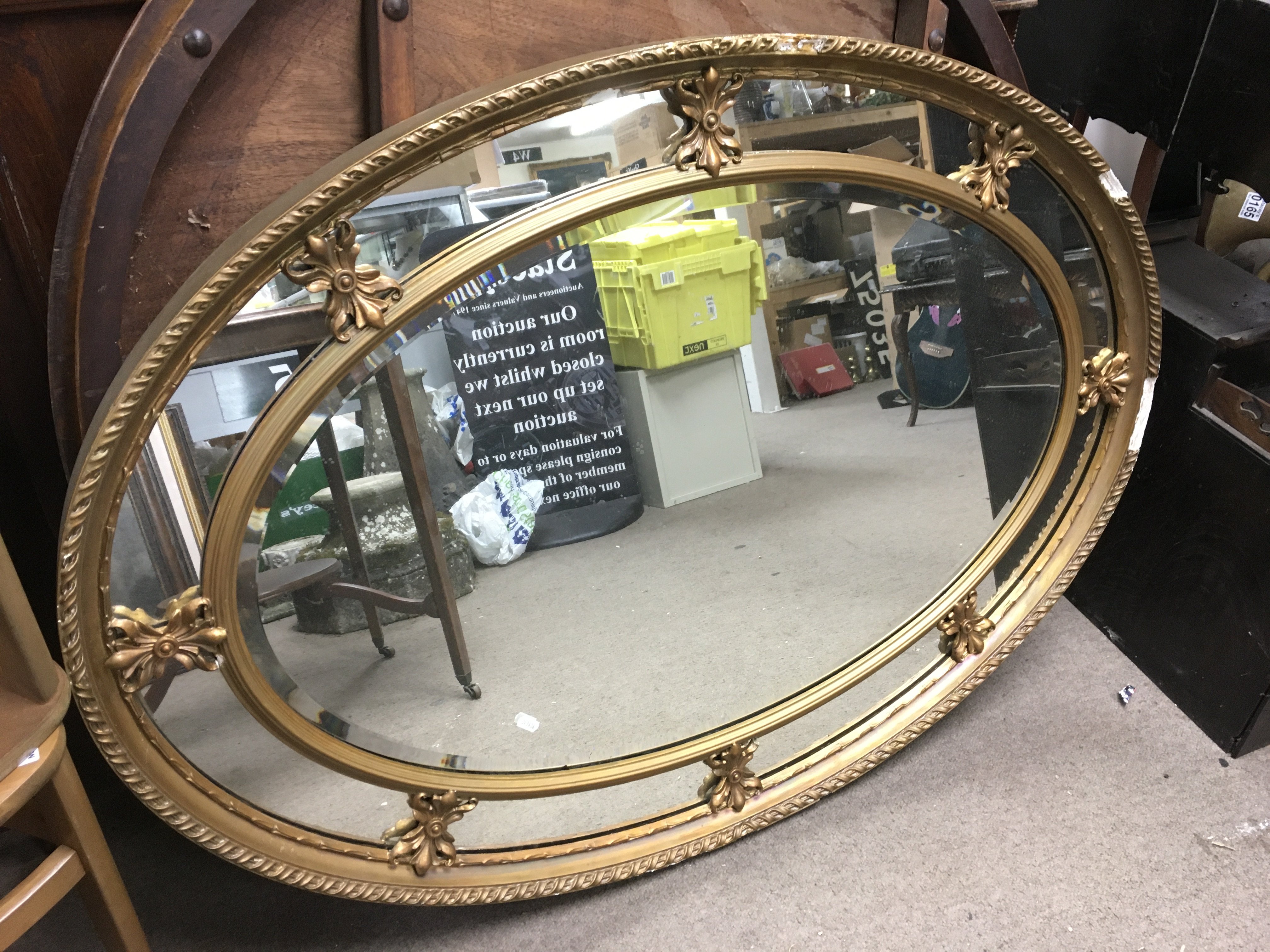 A large gilt framed oval wall mirror, approx width