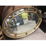 A large gilt framed oval wall mirror, approx width