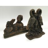 Two late Victorian cast iron door stops, approx heights 20cm and 15.5cm.