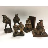 Five carved wooden figures including some WW1 sold