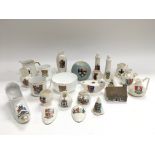 A collection of crested ware items including many