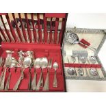 A Cutlery set (parts missing) and a spoon set.