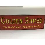 A vintage metal advertising sign for Golden Shred