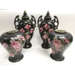 A pair of vases and covers decorated with flowers