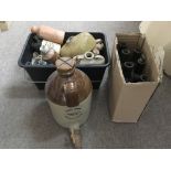 A collection of stoneware and glass bottles. NO RE