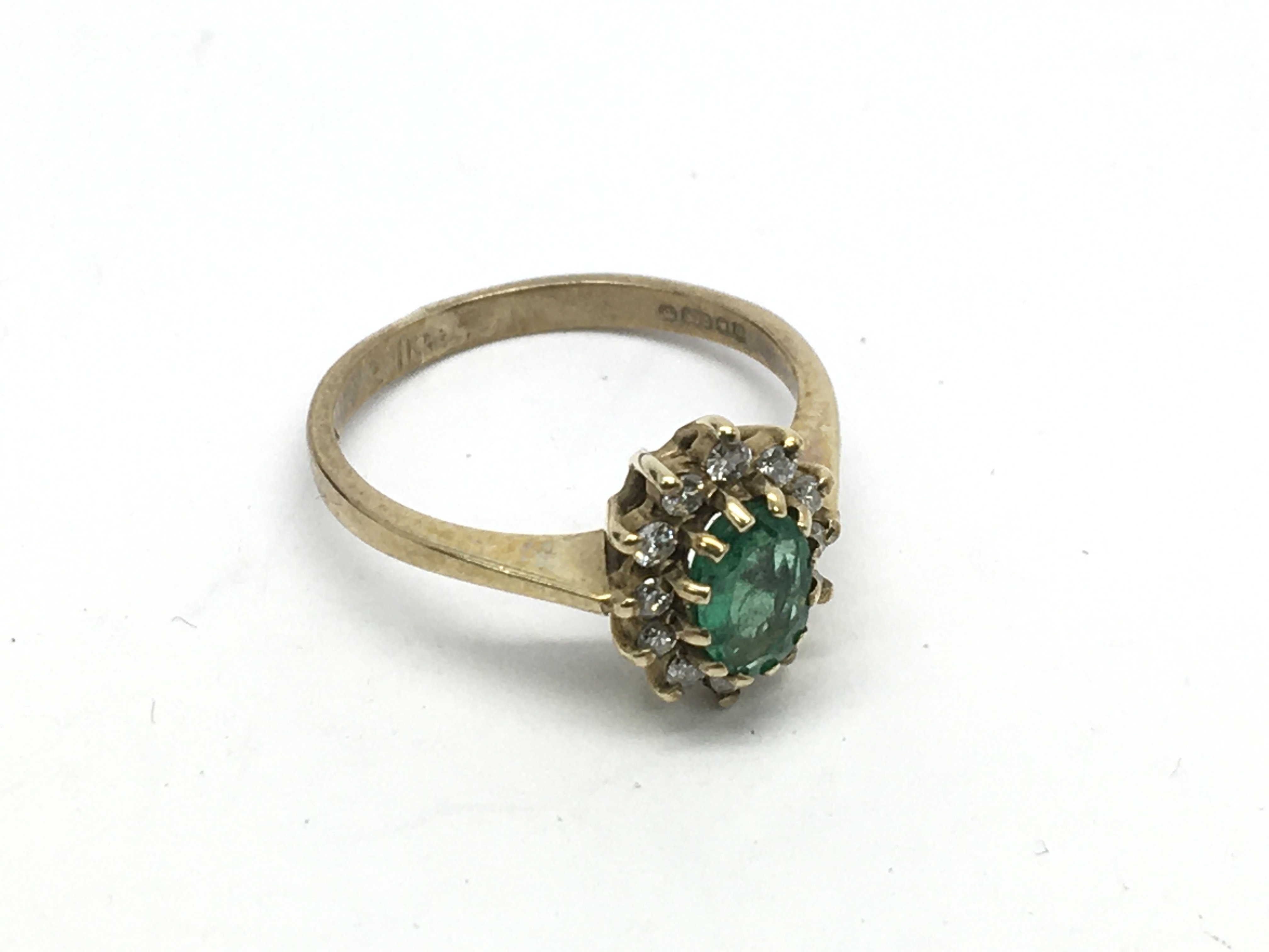 A 9ct gold emerald and diamond ring, approx 1.7g a