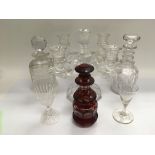 A Baccarat glass candelabra, two decanters and oth