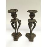 A pair of late 19th Century Empire revival candlesticks, approx height 18cm.