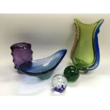 A small collection of coloured glass items includi