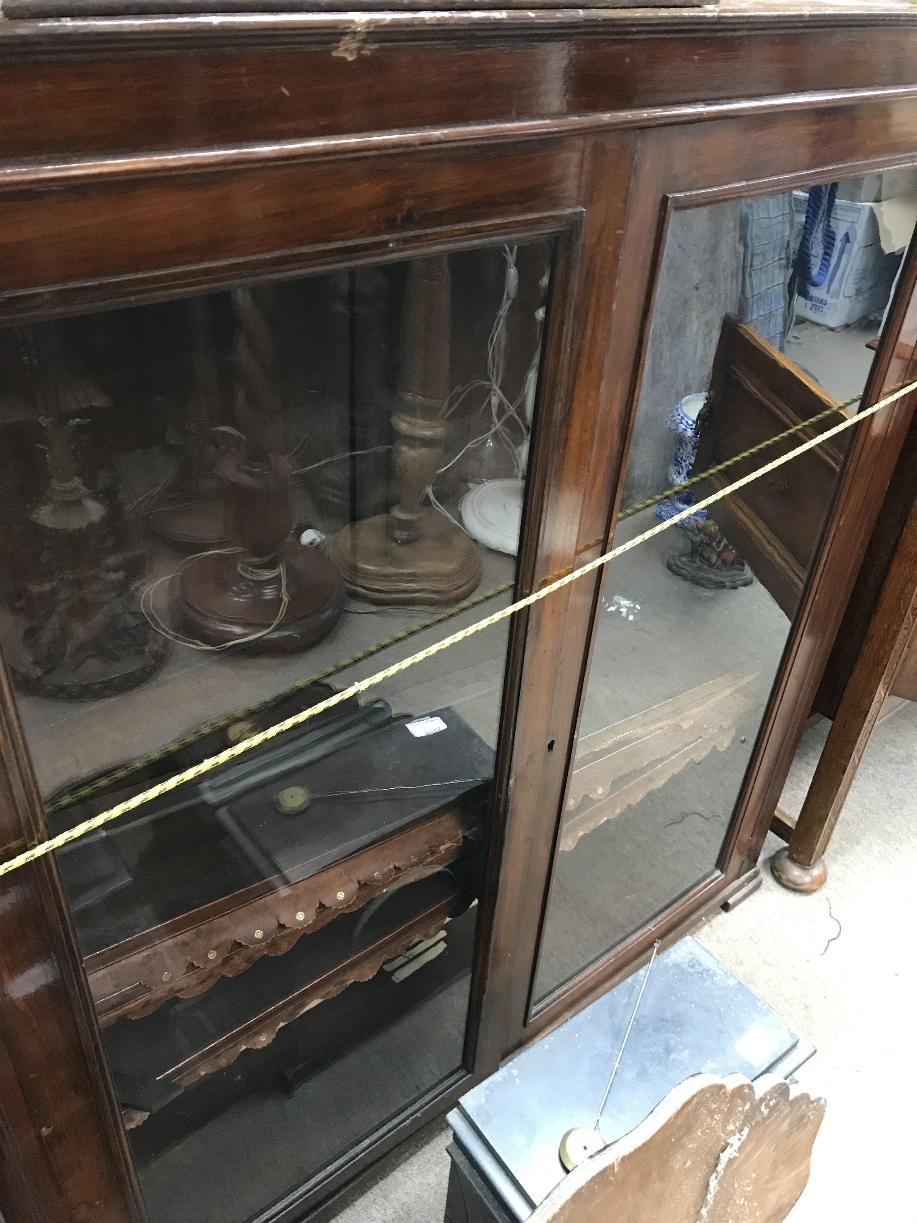 An Edwardian bookcase cupboard