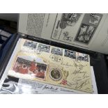 An album containing signed World Cup first day sta