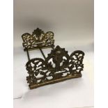 An ornate Victorian gilt brass expanding book stan