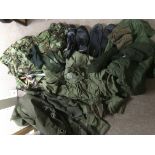 A bag of military fatigues, boots, hats etc. NO RE