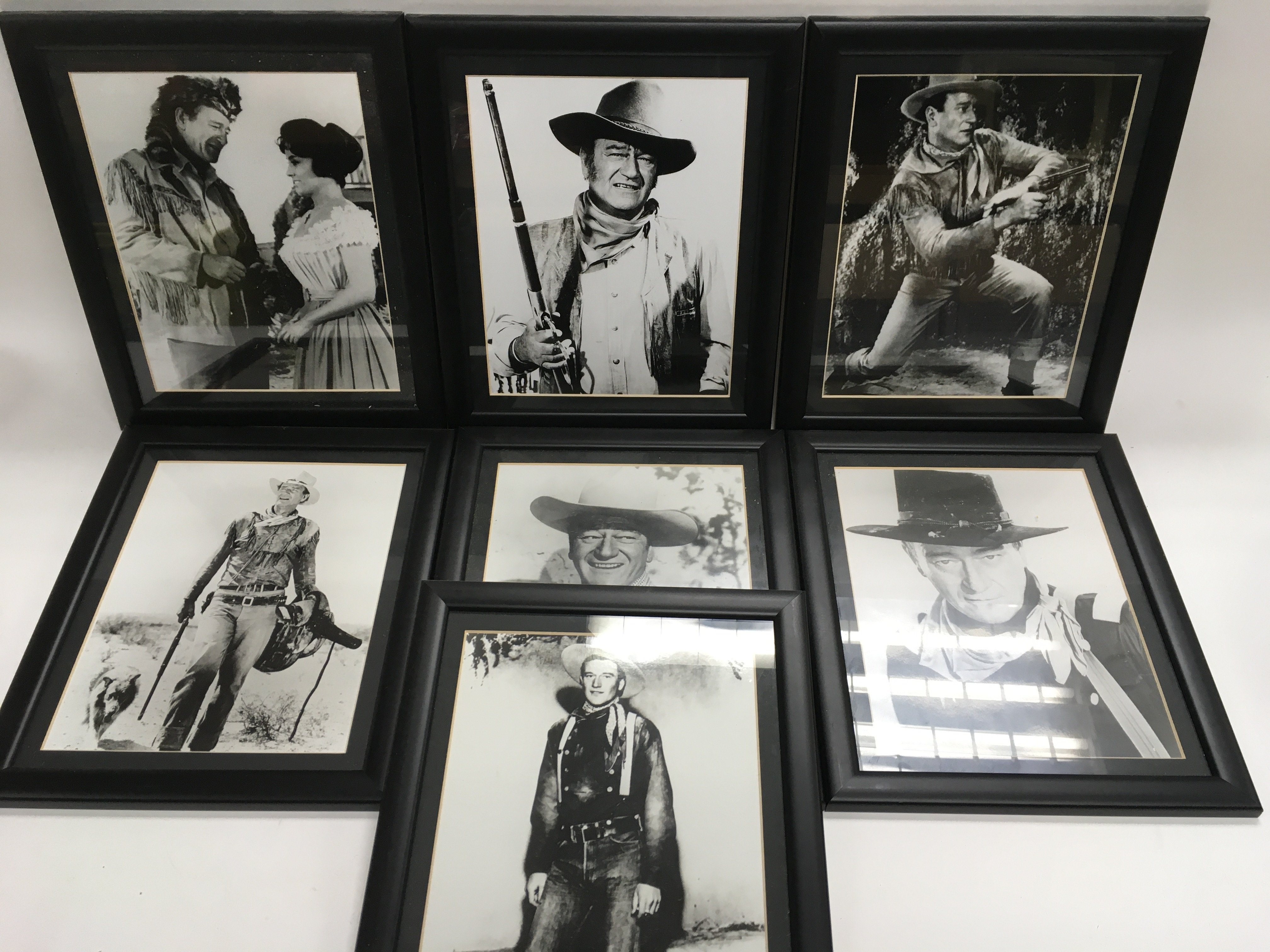 Seven framed black and white photographic prints o