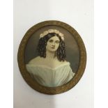 A gilt framed miniature on ivory of a young lady,