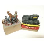 2 Tin Plate toys, a M45-Missile Tank and a bike wi