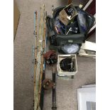 A collection of fishing equipment, rods, reels etc
