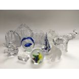 A collection of glass paperweights and ornaments.