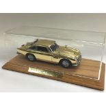 A Danbury Mint model of James Bond's Aston Martin