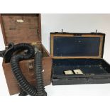 A surgical breathing apparatus and a tin box. (2)
