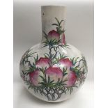 An Oriental vase with handpainted fruiting decorat