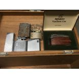A box containing six cigarette lighters including