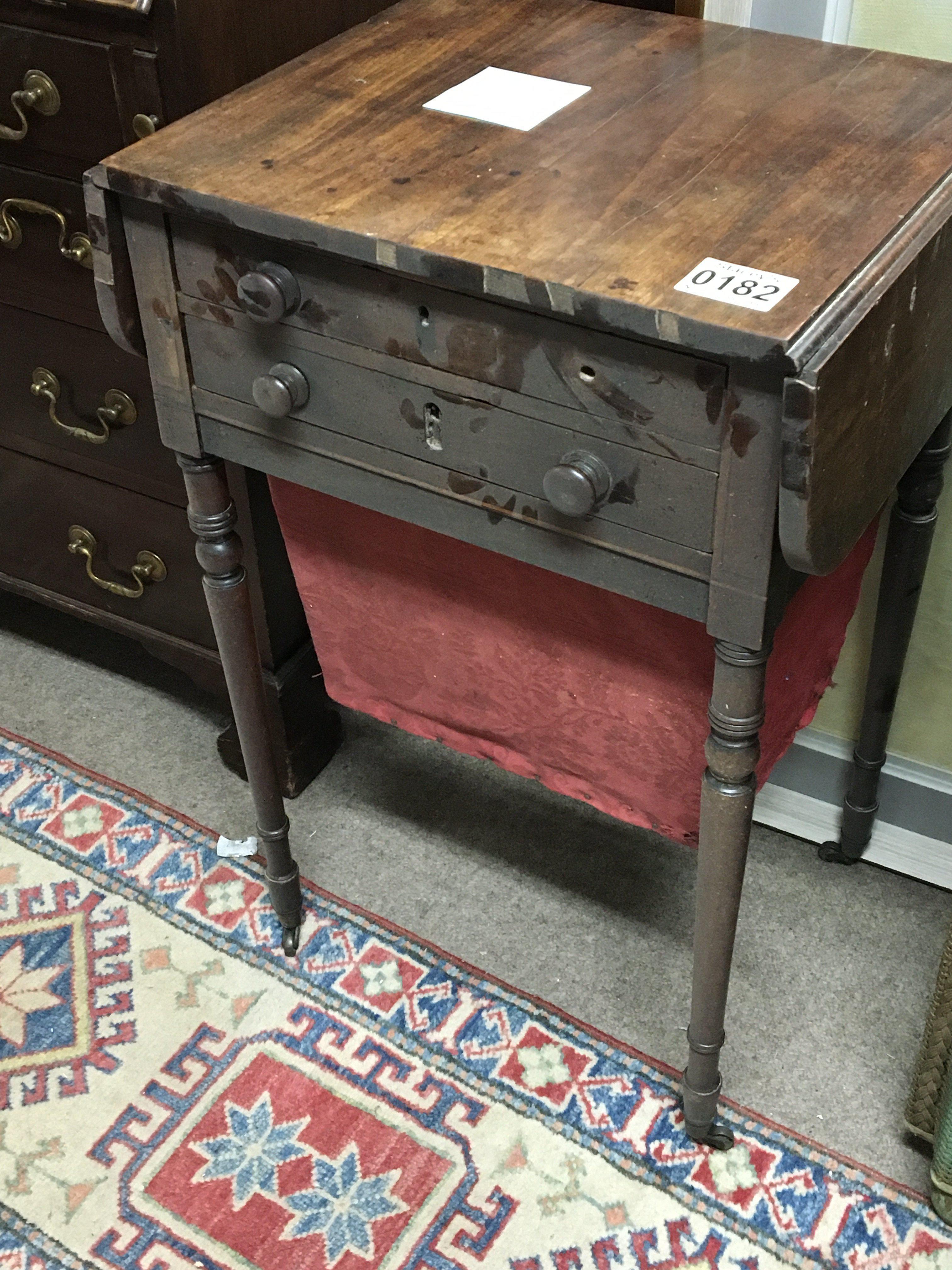 An Early Victorian Mahogany work box table the top