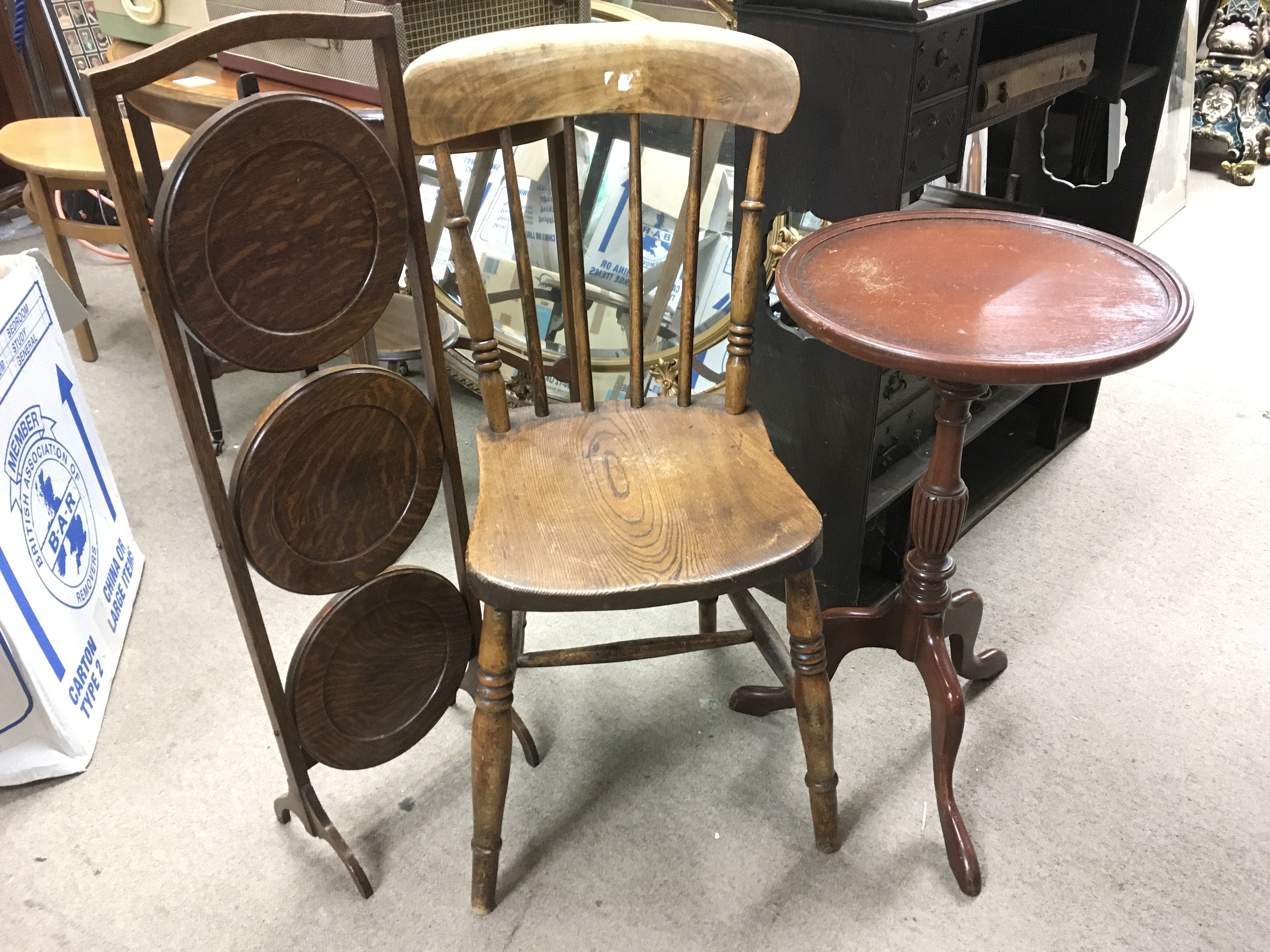 An oak chair, three tier folding stand and a circu