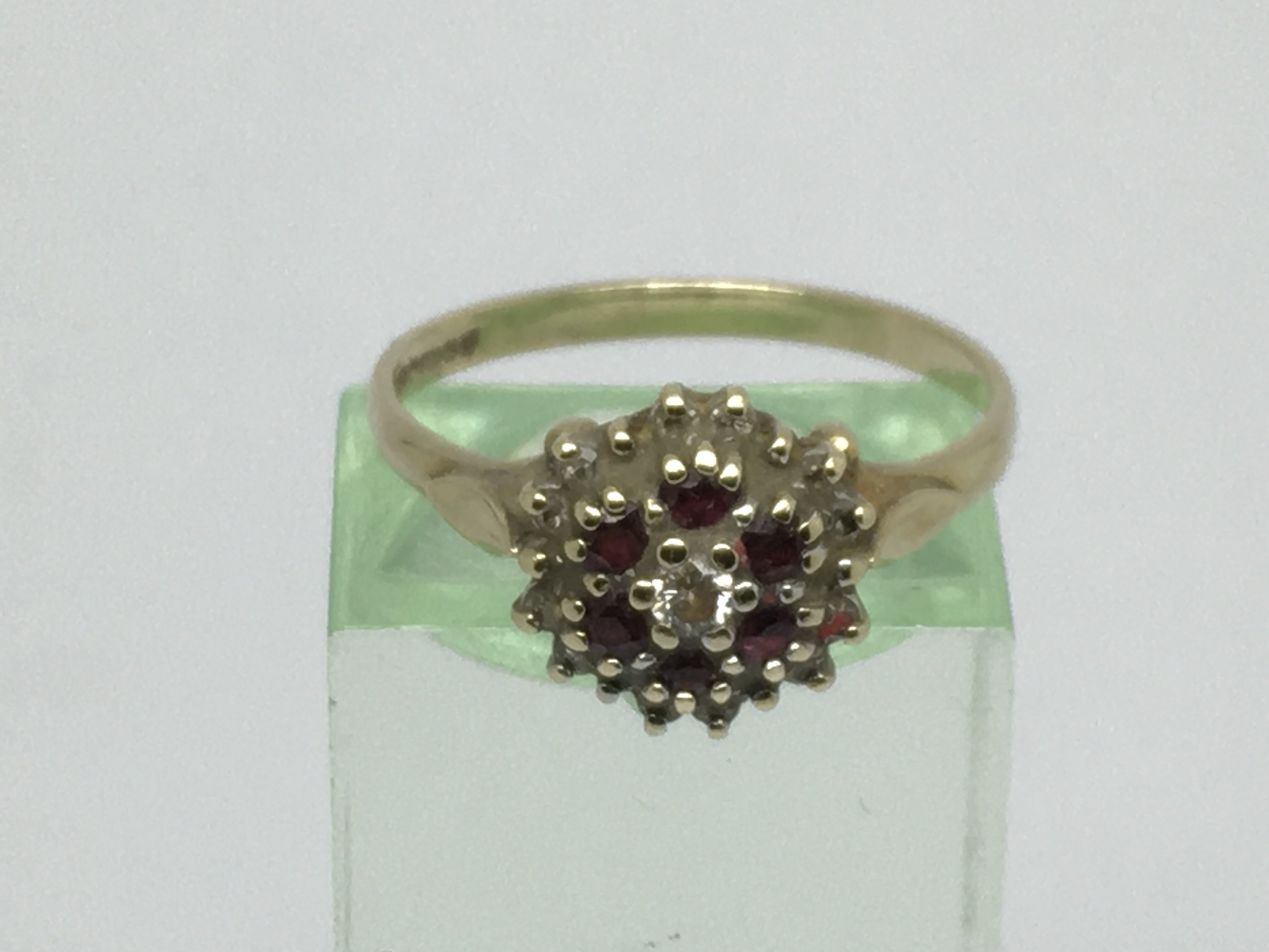 A 9ct gold ring set with rubies, approx 2.3g and a