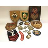 A collection of military insignias, badges and pat