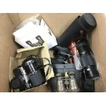 A box of cameras and binoculars. NO RESERVE.