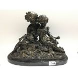 A heavy bronze figural group bronze of a boy and g