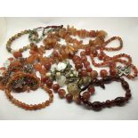 A collection of gemstone necklaces and bracelets i