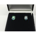 A pair of 9ct gold opal doublet earrings