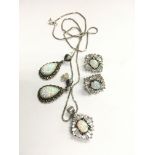 A sterling silver Opal and CZ necklace and earring