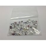 A bag of loose mixed stones including cubic zircon