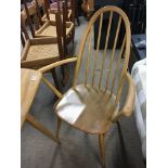 A blonde Ercol elm and beechwood kitchen table of